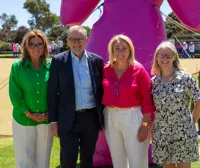 Prime Minister, Anthony Albanese, is standing with Kirsten Pilatti and Vicki Durstan from BCNA, and BCNA Consumer Representative, Andrea Smith. They are all smiling.