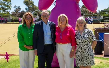 Prime Minister, Anthony Albanese, is standing with Kirsten Pilatti and Vicki Durstan from BCNA, and BCNA Consumer Representative, Andrea Smith. They are all smiling.