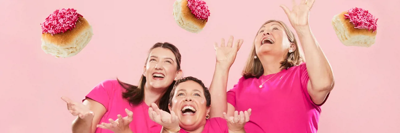 BCNA Baker Delight Pink Buns Falling Buns Pink Background
