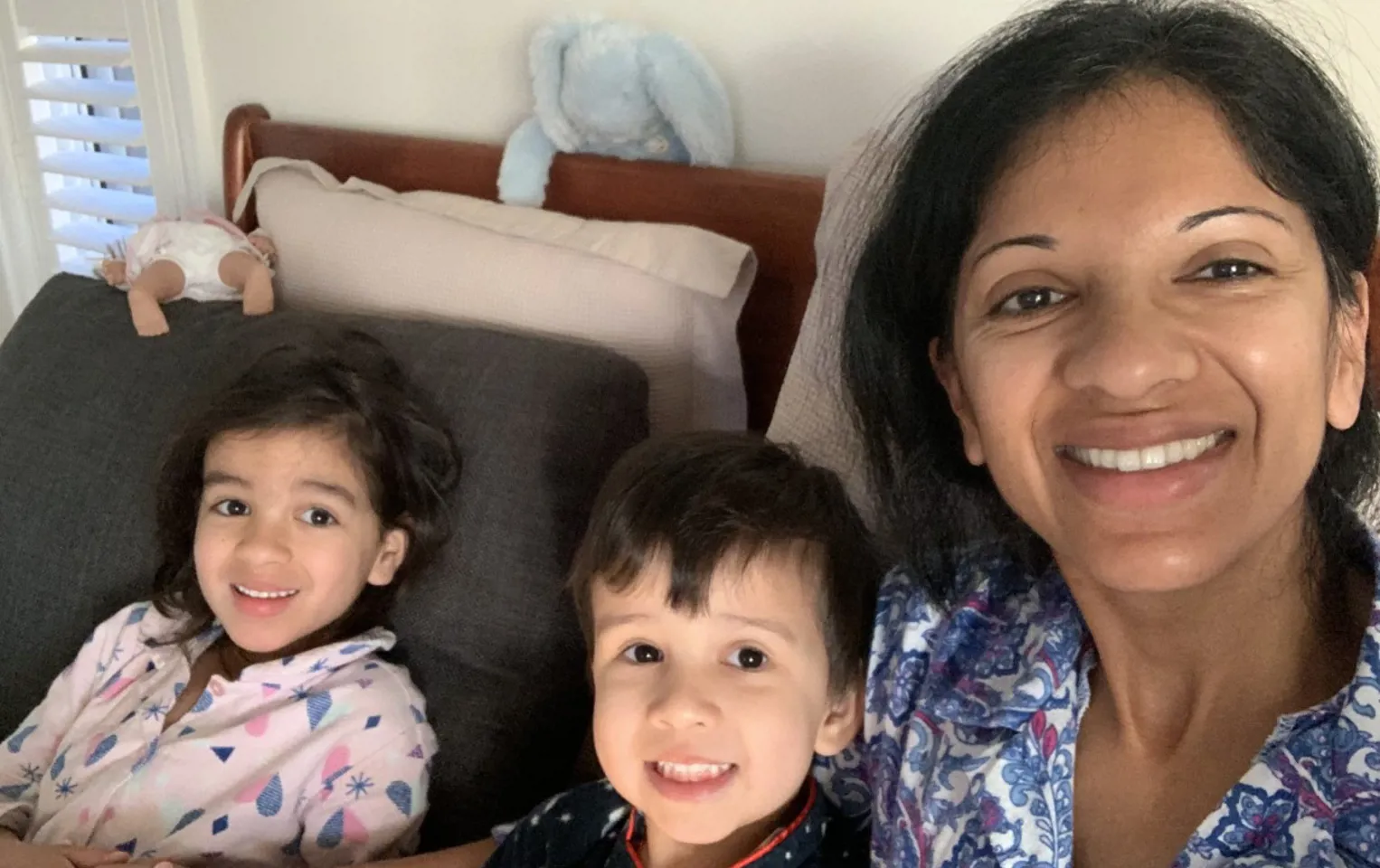 Selfie of Dipthi with her two young kids all smiling at the camera all wearing their pyjamas