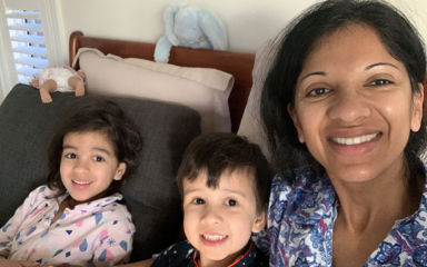 Selfie of Dipthi with her two young kids, they're all wearing pyjamas and smiling at the camera