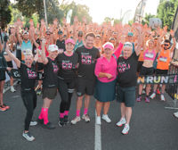 Photo of dozens of participants in the 2023 Carman's fun run, all dressed in pink and standing in the sunshine
