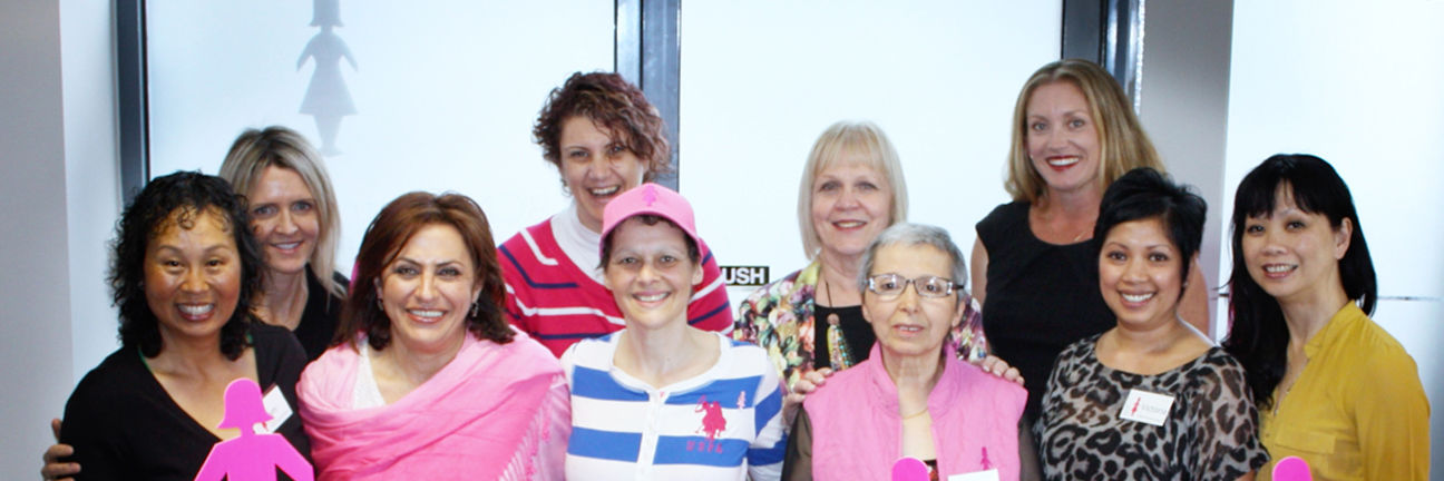 A group of multiethnic women standing together wearing BCNA pins