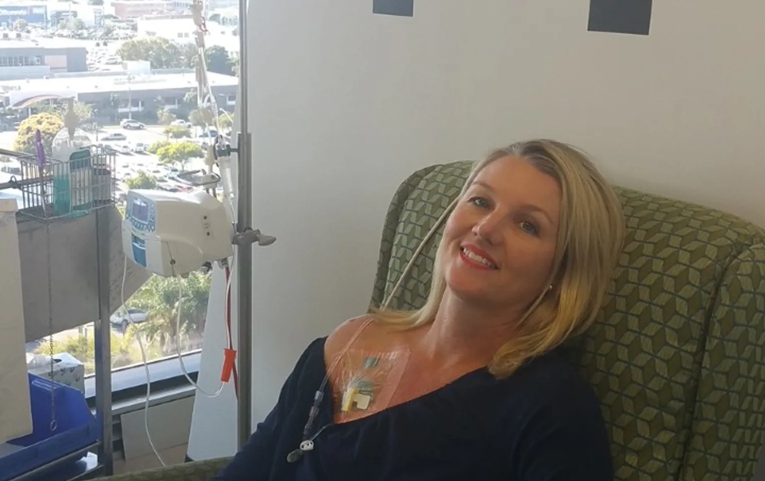Paula sitting in hospital chair having chemo