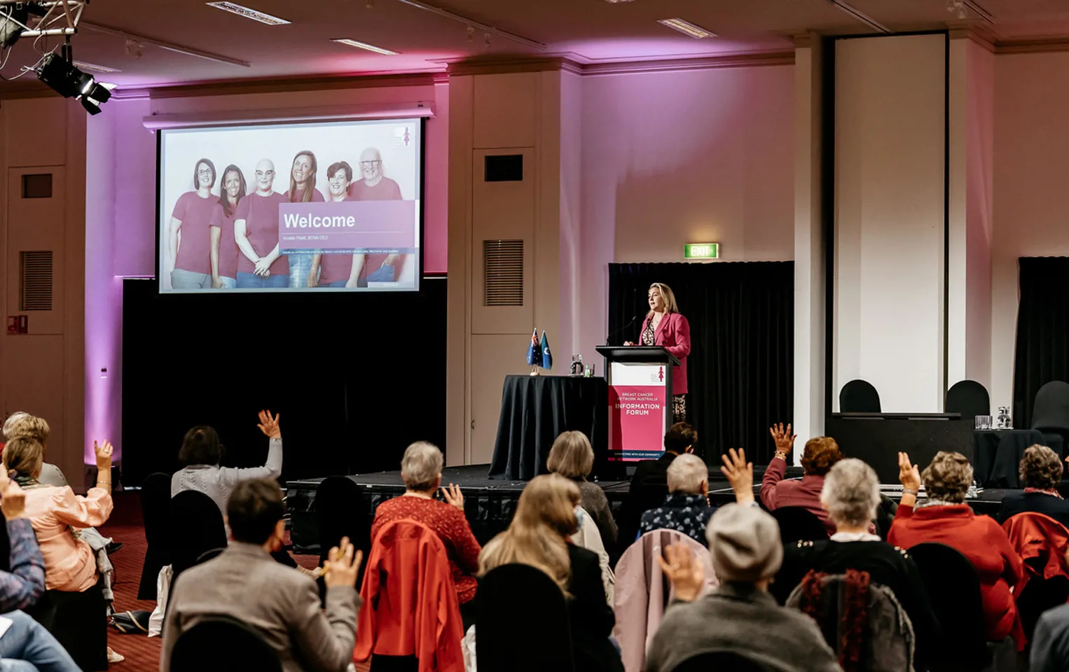 Photo from BCNA's first national conference, showing the presenter at a lectern and the backs of attendees' heads in the audience